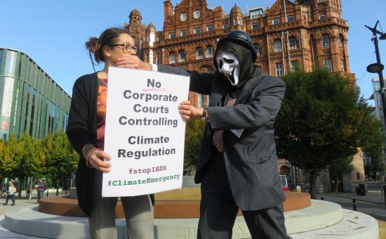 Global Justice Now supporters protesting against corporate courts