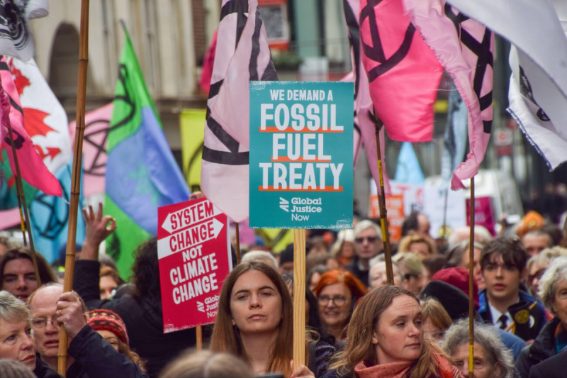 Fossil fuel treaty placard at climate march